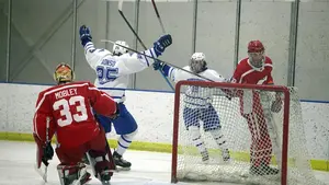 hockey players in action on ice