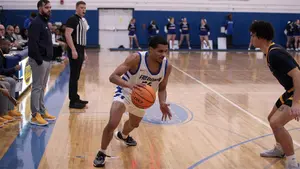 Keenan Roberts Jr. drives to the hoop on the basketball court