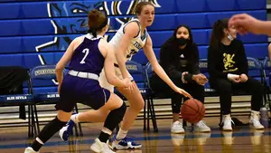 Mary Culeton playing basketball on court