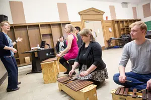 Dr. Jill Reese and students playing instruments