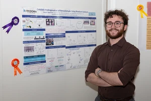 Sawyer Oppenneer, with his award-winning research poster.