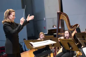 Dr. Paula Holcomb conducts the Wind Ensemble