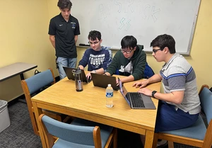 Collaborating on their Paychex project are (from left) Alexander G. Scalcione, Liam J. Walsh, Timothy Doan and Zachary J. Stofko.