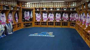 locker room with Pink the Rink jerseys