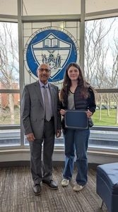 Melanie Tunstall, with her Student of the Month certificate, and Dr. Moj Seyedian.
