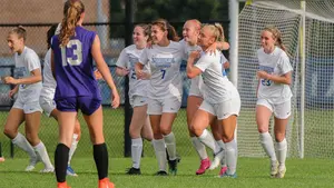 soccer players on the field celebrating