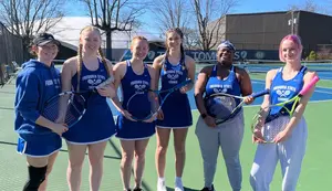 members of the women's tennis team in uniform