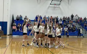 volleyball team celebrating