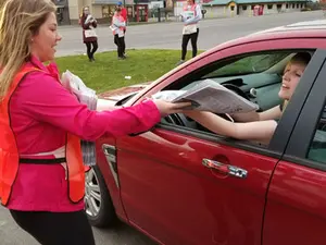 photo of student selling newspaper