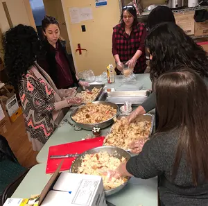 Members of the Fredonia Democracy Initiative prepare food at Chautauqua Rural Ministry in Dunkirk