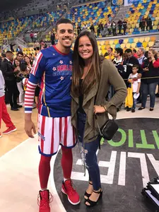 Tyrone Clark and Rebecca Hebert on basketball court