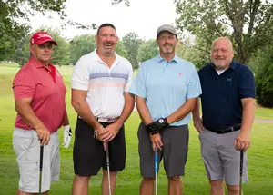 foursome winner of the Alumni Golf Tournament