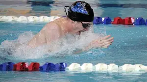 man swimming in pool, men's swimming 