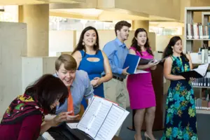 students singing in the library