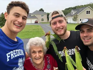 photo of local citizen with hockey team members