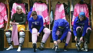 hockey players in Pink the Rink gear