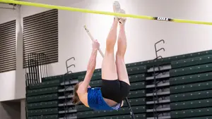 woman pole vaulting