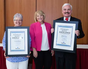 Dr. Carmen Rivera (far left) with President Virginia Horvath and Mike Igoe