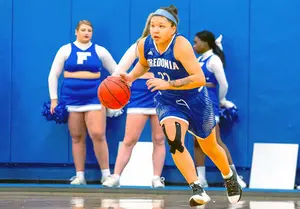 Rae White dribbles up court during Sunday's win over Potsdam at Dods Hall.