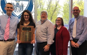 Student of the month with university staff members