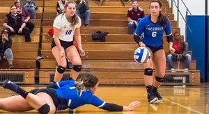 Rachel Aiello (18) and Kailey Falk (6) watch the hustle of SallyAnne Rudny (Ron Szot photo)