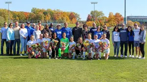 women's soccer team with family members, women's soccer