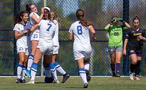 The Blue Devils celebrate one of their seven goals