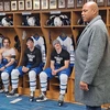 Charles Barkley in hockey locker room with players