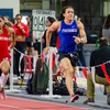 Jordan Lockett and others running on the track