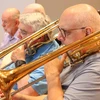 band members playing trombone in a rehearsal