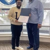 Niles Emile holding certificate, with David White