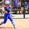 softball player in action ready to strike ball