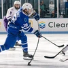 hockey players in action on the ice