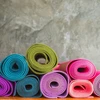 pile of rolled yoga mats